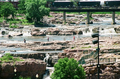 [People walking to get a closer view of the falls.]